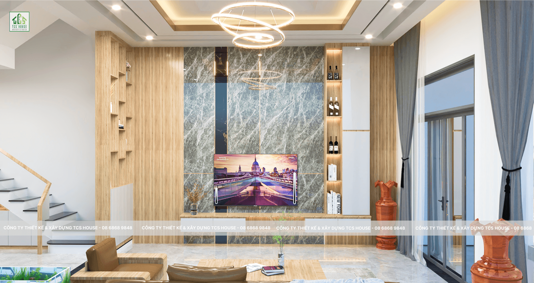Nội thất phòng khách nhà phố 2 tầng 5x28m Tam Kỳ. Phối vảnh bàn ghế gỗ phối nệm sofa trẻ trung và hiện đại. Đèn led làm cho ngôi nhà trở nên ấm áp. Được thiết kế đèn chiếu sáng hiện đại và sang trọng. Tivi gắn tường với trang trí tủ đựng trẻ trung và tiện nghi.